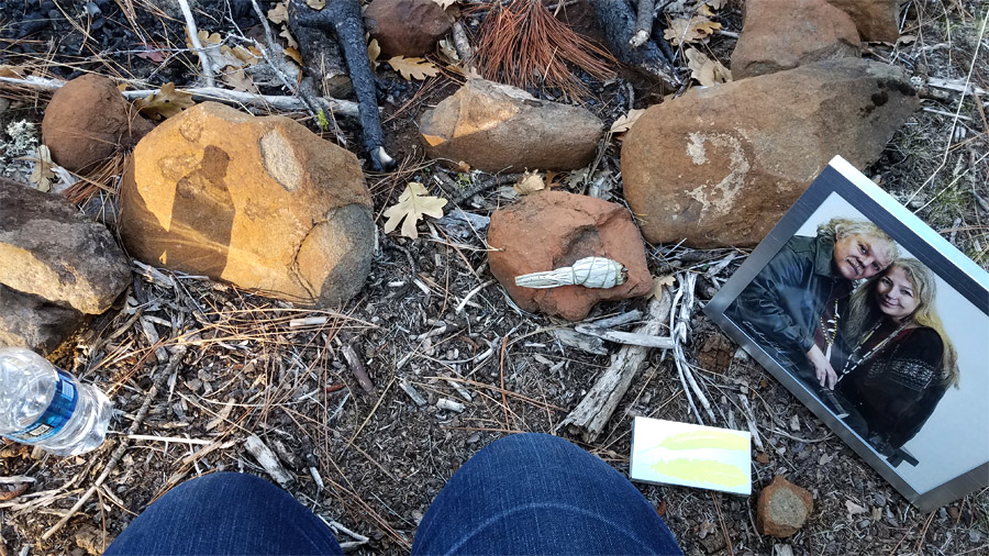 a sage smudge and family photo beside the White Eagle fire circle