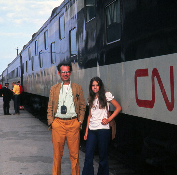 1970s passengers stand beside CN train