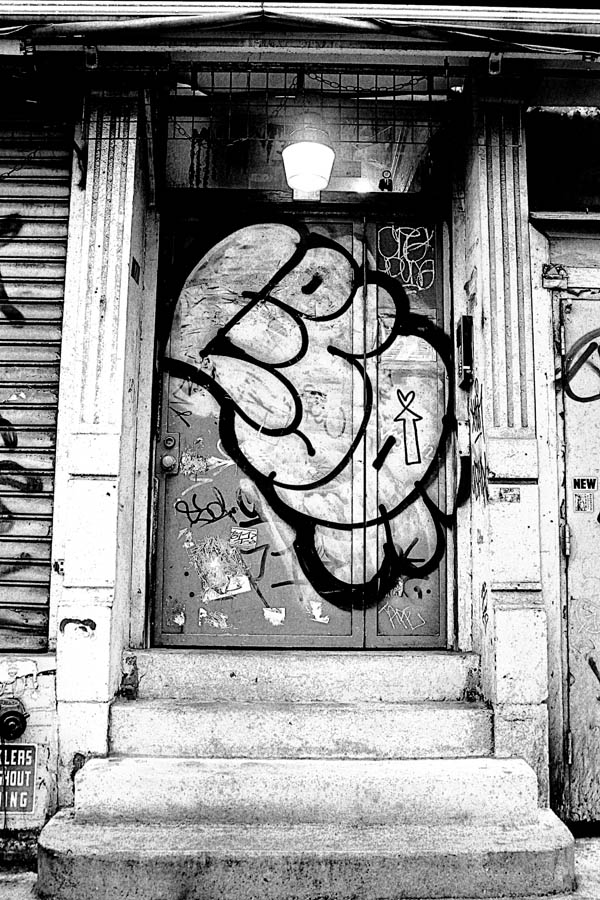 graffiti-tagged door in Soho, New York City