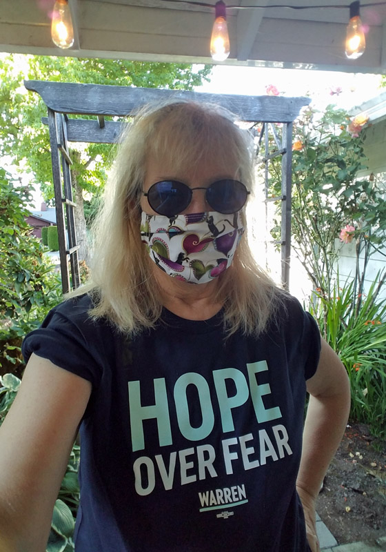 author wears Hope Over Fear tee shirt